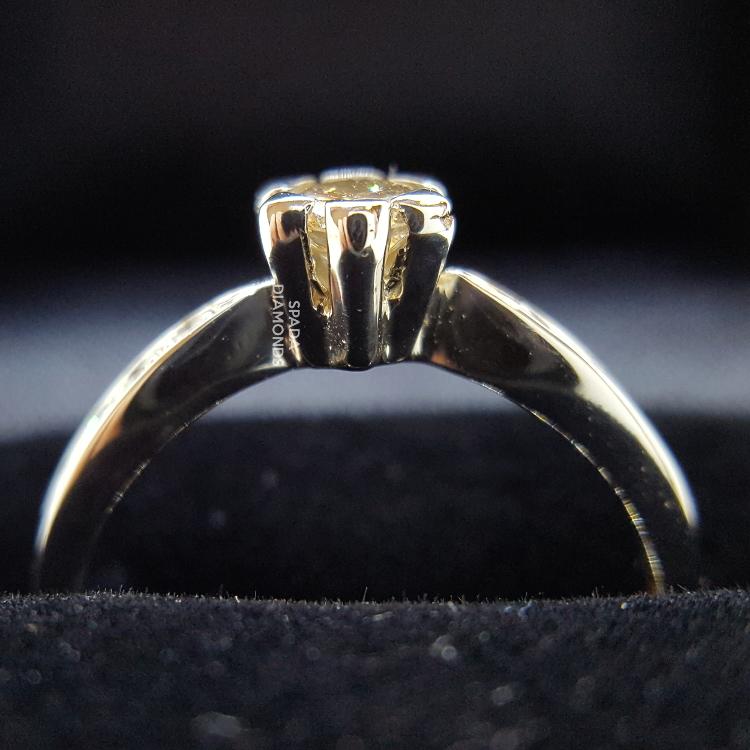 9 karat white gold flower design diamond engagement ring with side diamonds