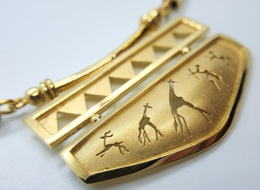 18 karat yellow gold africa rock art necklace with elephant hair